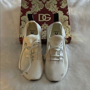 white sports shoes on.